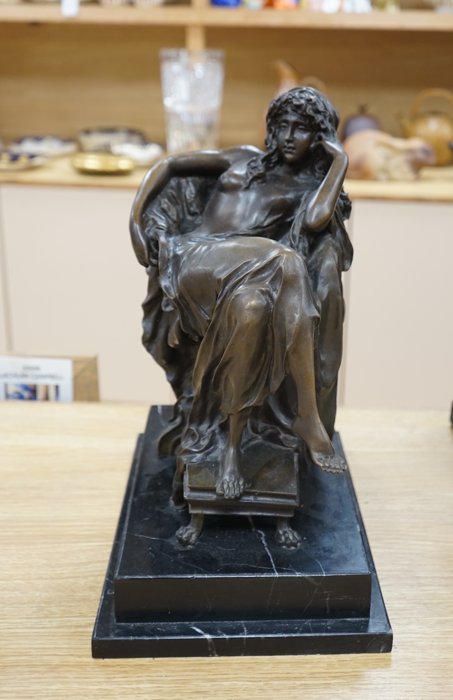 A decorative bronze study of a seated woman, raised on a stepped marble plinth, signed Chiparus, 41cm high. Condition - good